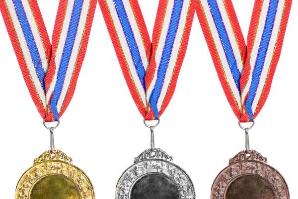 Gold, silver, and bronze medals. Image Source / Getty Images