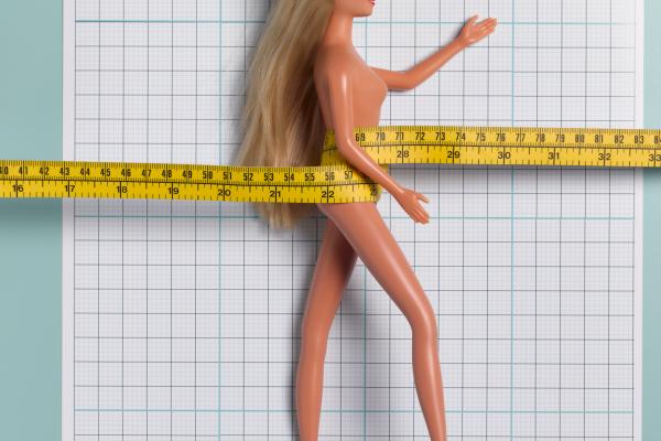 Child's doll with tape measure, Peter Dazeley / Getty Images