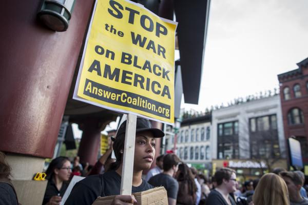 Protestors in DC march in solidarity with Baltimore. Image via JP Keenan/Sojourn