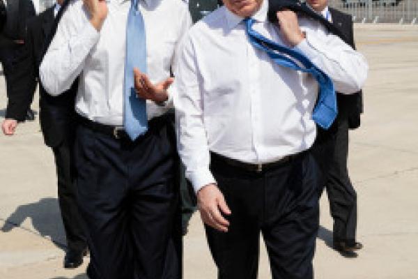 President Barack Obama walks across the tarmac with Israeli Prime Minister Benja