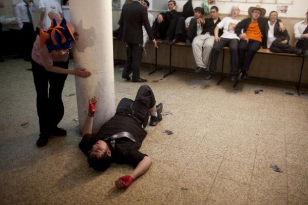 Drunk man during Purim festivities in Israel, 2011. Photo by Uriel Sinai/Getty I