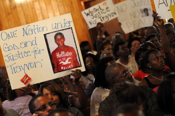 Residents attend to a town hall meeting 2/20 to discuss Martin's slaying. Getty 