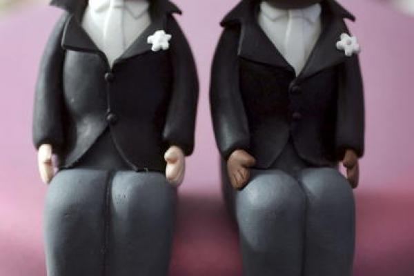 Wedding cake topper photo by Christopher Furlong/Getty Images.