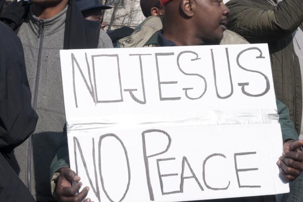 A protester holds a sign at the Justice for All march on Saturday in Washington.