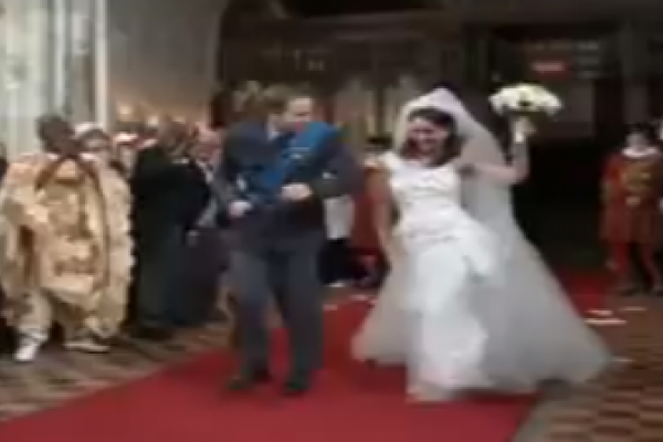 Screenshot of T Mobile video featuring actors as William and Kate. 