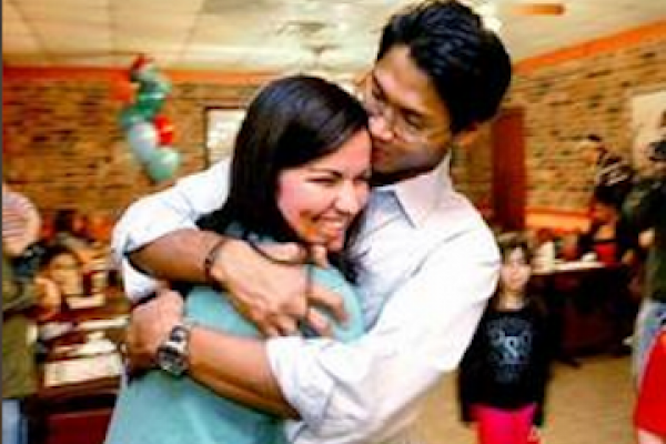 Naz and Hope embrace after 10 months apart. Photo courtesy freenaz.com