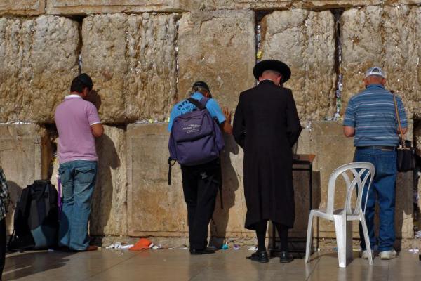Tourists pray at the Wailing Wall in Jerusalem. Via Wylio http://bit.ly/wsudSt.