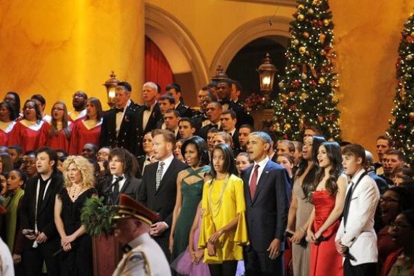 Justin Bieber (far right) sings with the Obama family at the Christmas in Washin