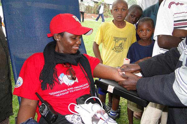 A Ugandan woman undergoes an HIV test in a program funded by PEPFAR. Image via W