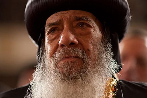 Pope Shenouda III, the Coptic Christian pontiff, listens to President Obama deli
