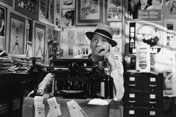 Photo: Man thinking at typewriter, Everett Collection / Shutterstock