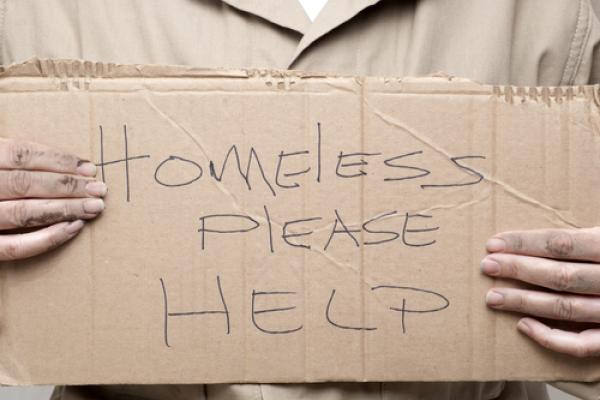 Homeless person asking for help, Kim Reinick / Shutterstock.com