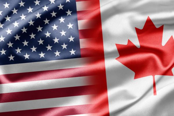 United States and Canadian flags,  ruskpp / Shutterstock.com
