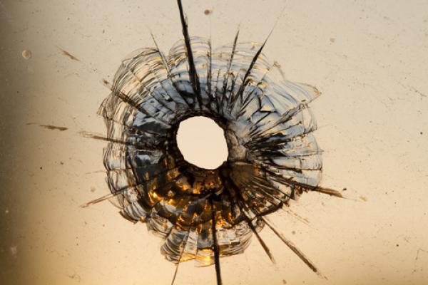 Gun shot in window, Iurii Konoval / Shutterstock.com