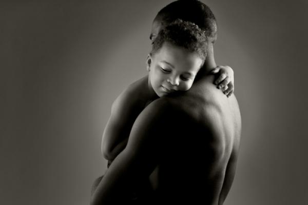 Father and son embrace. Photo courtesy stefanolunardi/shutterstock.com