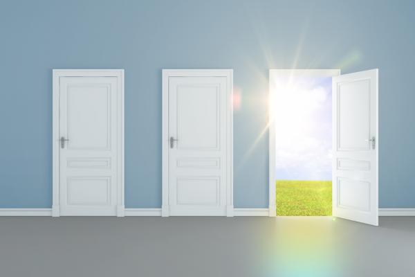 A door opens to light. Image courtesy Peshkova/shutterstock.com