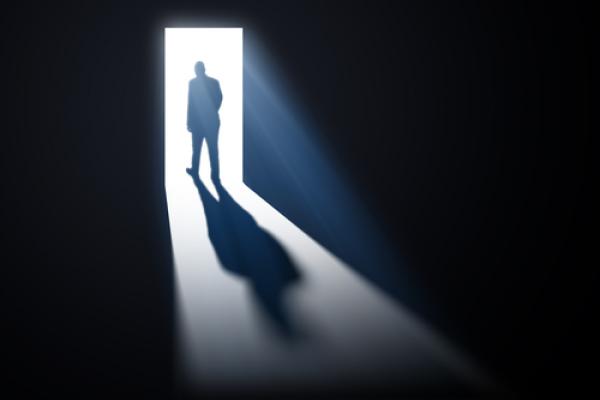  man walking through open doors, Mopic / Shutterstock.com
