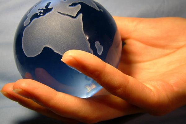 Globe in hand,  Magdalena Bujak / Shutterstock.com