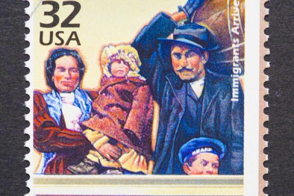 Stamp of an immigrant family. Photo courtesy catwalker/shutterstock.com