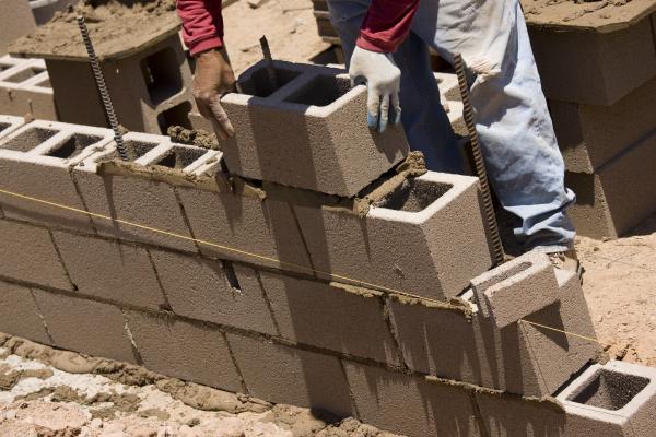 Cinder brick laying, Lou Oates / Shutterstock.com