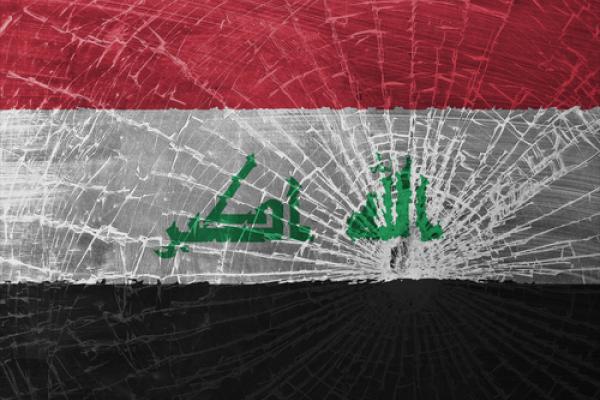The Iraqi flag, shattered. Image courtesy MyImages - Micha/shutterstock.com