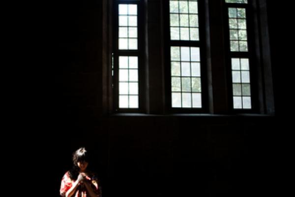 Woman in church, fztommy / Shutterstock.com