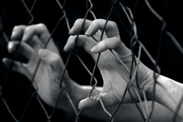 Sex trafficking illustration, ChameleonsEye / Shutterstock.com