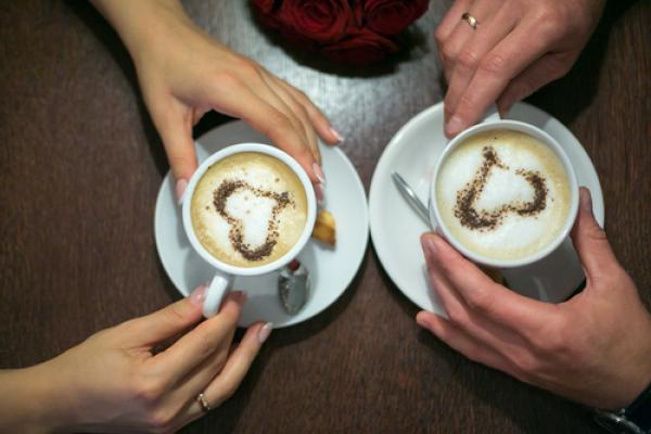Married couple with coffee mugs. Photo courtesy Hot Photo Pie/shutterstock.com