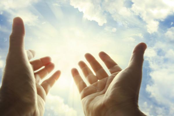 Hands in prayer. Image via STILLFX/shutterstock.com