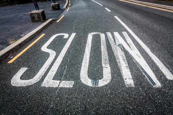 Slow down sign, Semmick Photo / Shutterstock.com