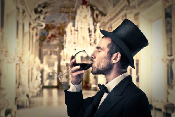 Rich man drinking wine, ollyy / Shutterstock.com