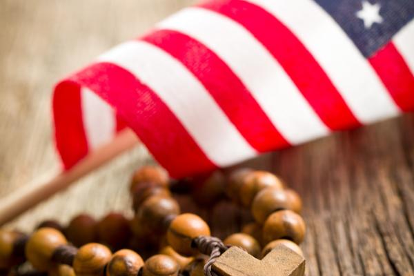 Cross and flag. Image via Jiri Hera/shutterstock.com