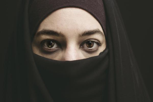 Woman wearing a burqa. Photo via Shutterstock / RNS