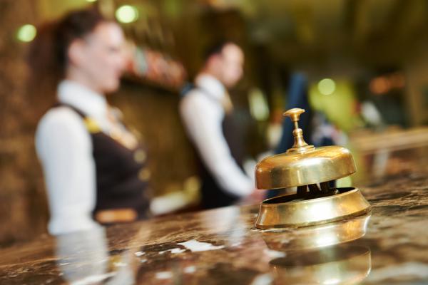 An inn's reception counter with bell. Image courtesy Dmitry Kalinovsky/shutterst