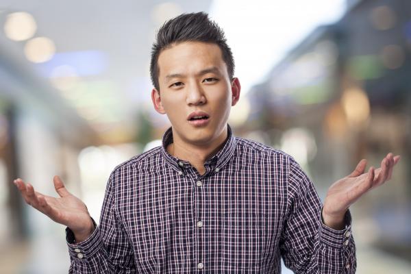 Young man doubting, Asier Romero / Shutterstock.com