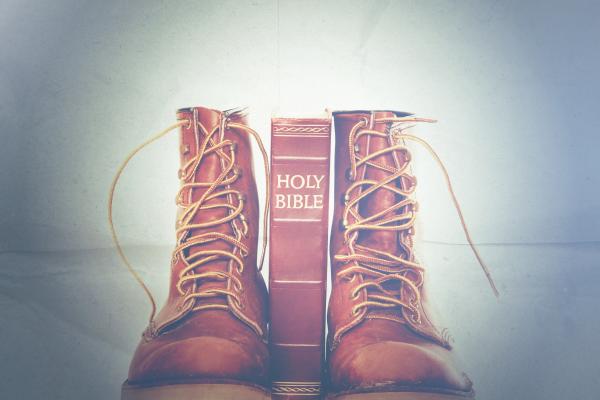 Bible and boots, Paul Matthew Photography / Shutterstock.com