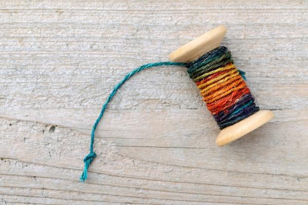 Spool of old thread. Image via TAGSTOCK1/shutterstock.com