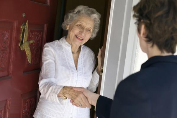 Door-to-door solicitor photo, EdBockStock / Shutterstock.com