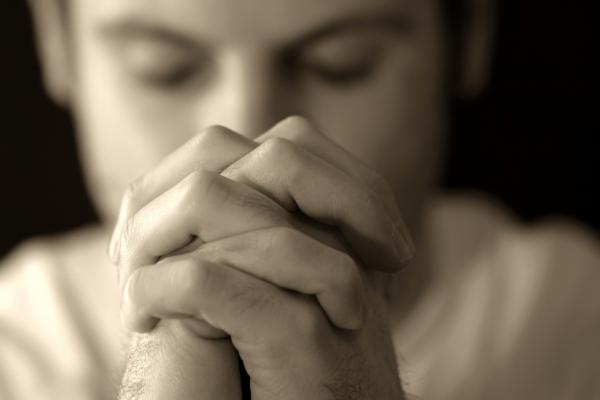 Man Praying, Kevin Carden/Shutterstock.com