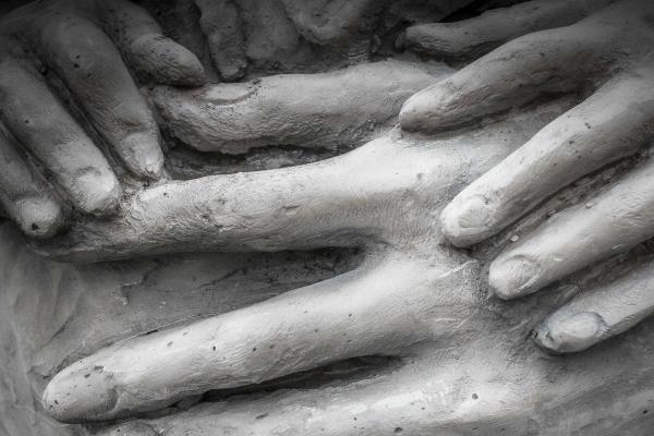 Statue of mother and child hands