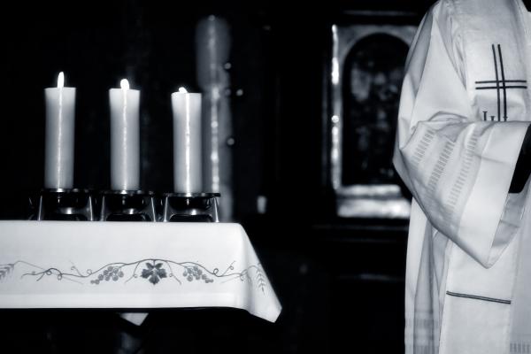 Priest during Mass, Gordan / Shutterstock.com