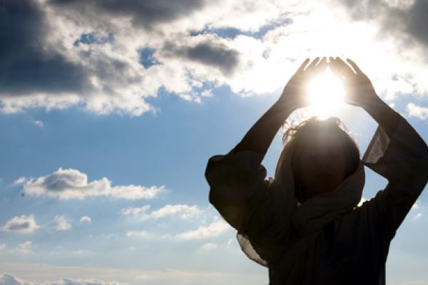 Young woman meditating, Luna Vandoorne / Shutterstock.com