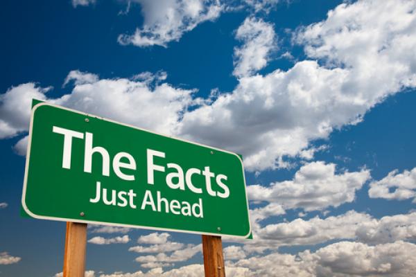 Just the Facts signage, Andy Dean Photography / Shutterstock.com