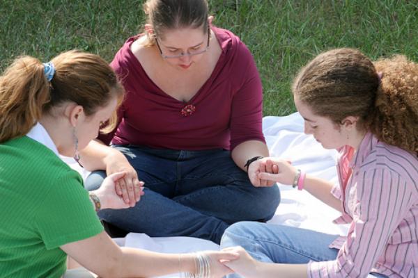 Photo: Group prayer circle, Lisa F. Young/ Shutterstock.com