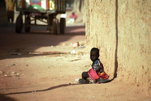 Photo: Child sitting in the dust in  Attila JANDI / Shutterstock.com