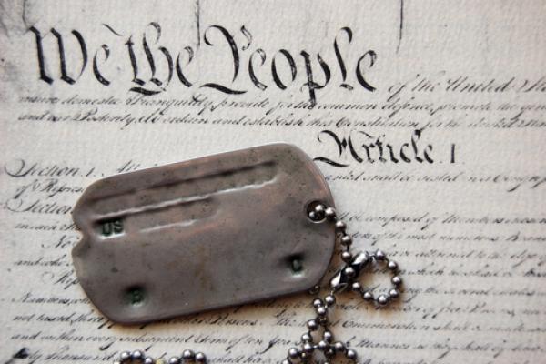 Photo: Dogtags on the Constitution, Sergey Kamshylin / Shutterstock.com