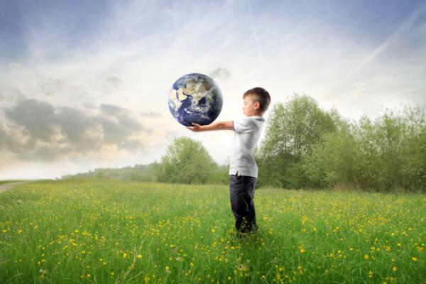 Child holding the earth, olly, Shutterstock.com