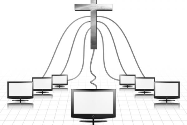 A cross plugged into computer screens. Illustration courtesy Bruce Rolff/shutter