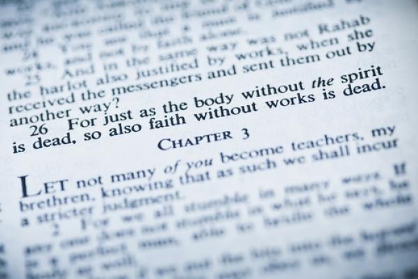 Bible opened to book of James, Vibe Images / Shutterstock.com
