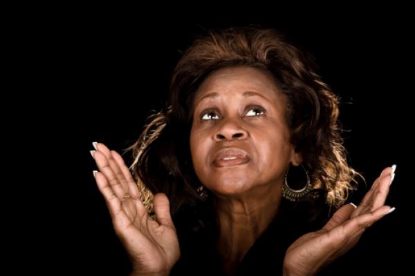 Photo: Woman praying, © John Wollwerth  / Shutterstock.com